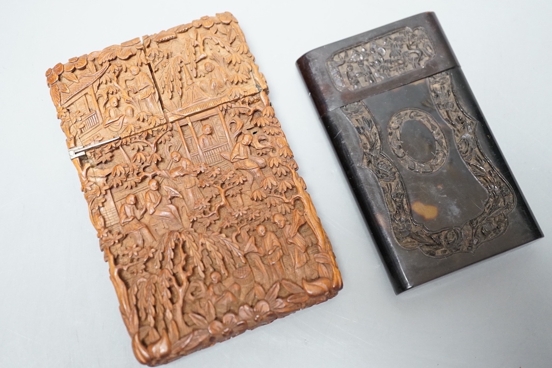 A 19th century Chinese tortoiseshell card case and a similar carved sandalwood card case, 11 cms high x 7 cms wide.